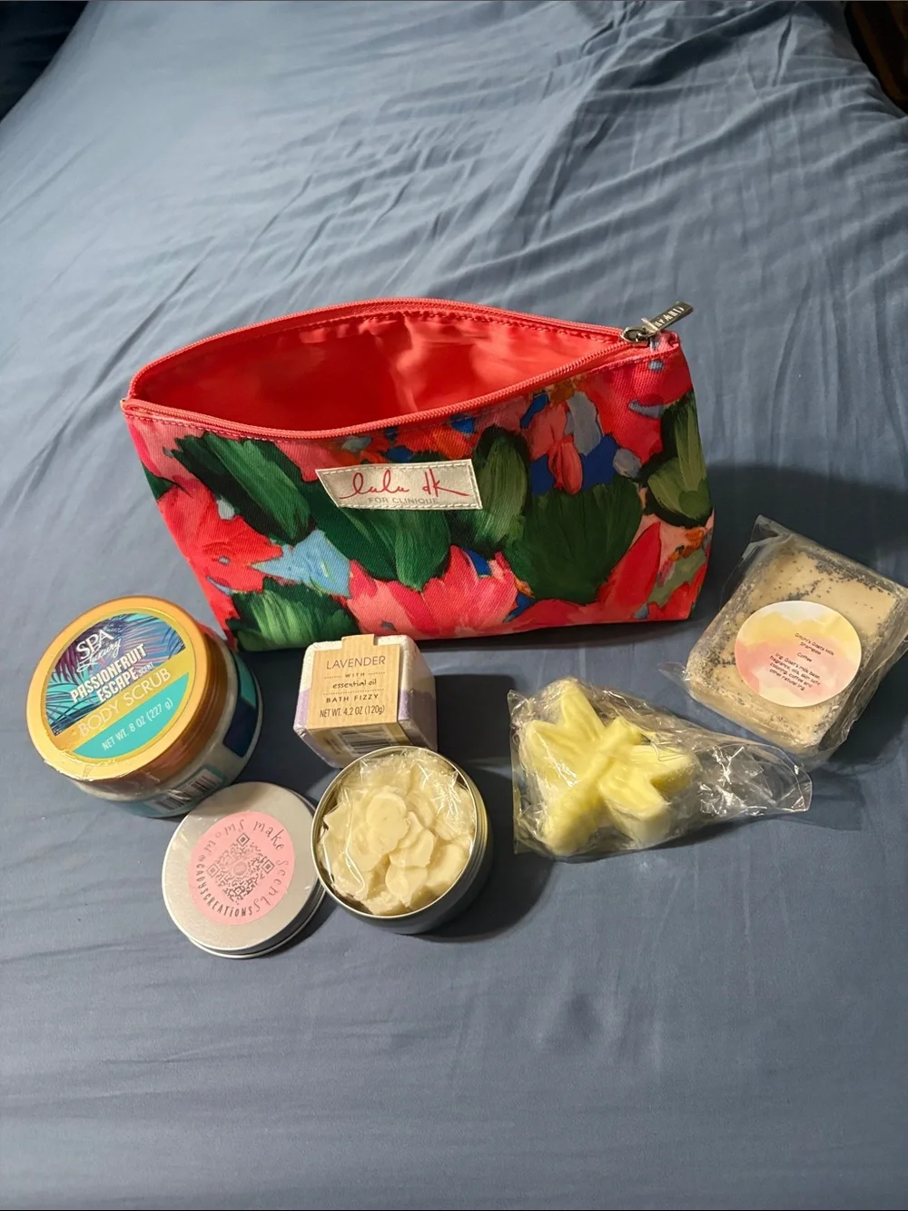 Pink Clinique Cosmetic Bag with bath fuzzy, scrub, lotion bar, shampoo and soap
